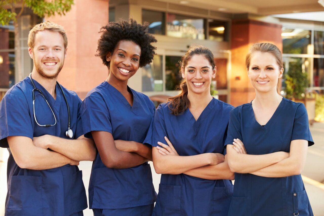 A group of people in blue scrubs